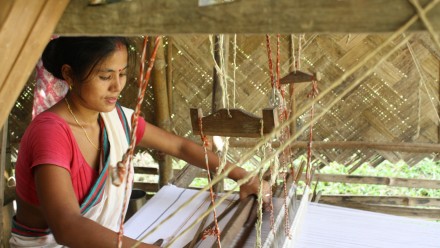 Rekha Doley, a Master Artisan with Impulse Empower, weaving from her home in Assam. Photo: Impulse Social Enterprises.