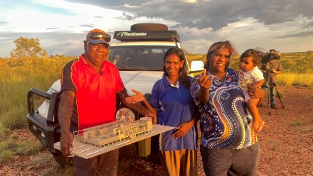 Indigenous Elder Norman Frank holding a model of a proposed Wilya Janta home, with Serena Morton, and Nicole Frank. Photo: Simon Quilty. 