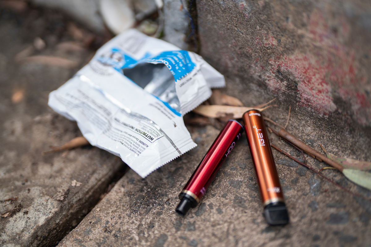 Reducing access to e-cigarette use is key to protecting teens. Photo: Jack Fox/ANU Two vapes and their packaging.