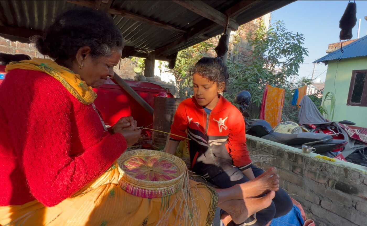 Dr Uday Yadav’s mother works on some basket weaving. Photo: supplied. Dr Uday Yadav’s mother works on some basket weaving. Photo: supplied.