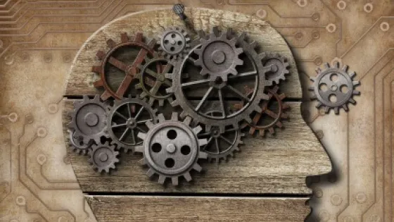 Illustration of a human head profile filled with mechanical gears on a circuit board background.