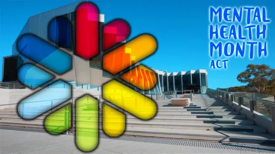 A colorful graphic overlay of pill shapes on a modern building promotes Mental Health Month ACT.