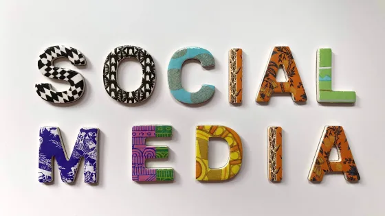 Colorful, textured letters spelling out "SOCIAL MEDIA" on a white background.