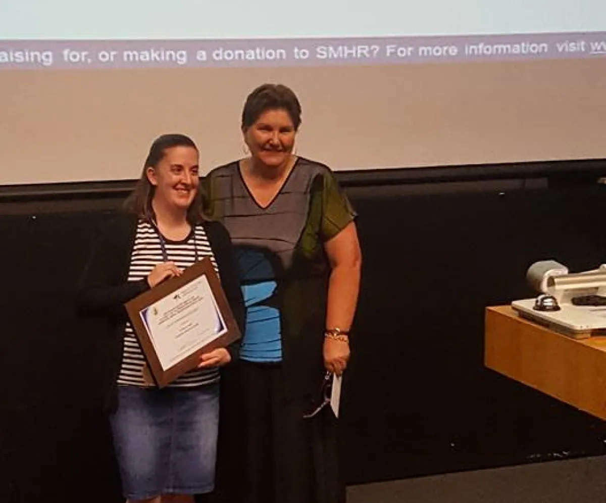 Alison receiving award