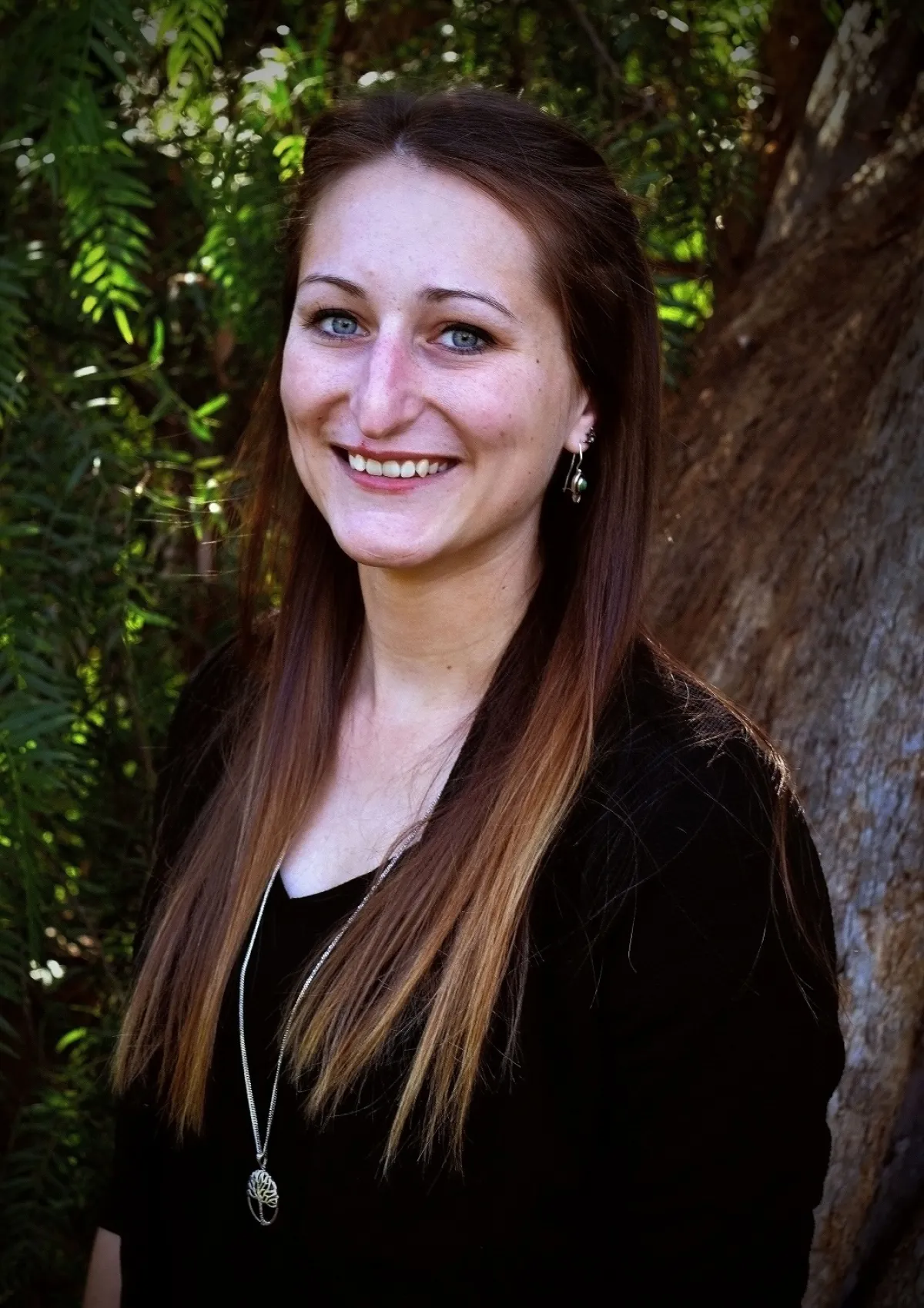 A woman looking at camera smiling