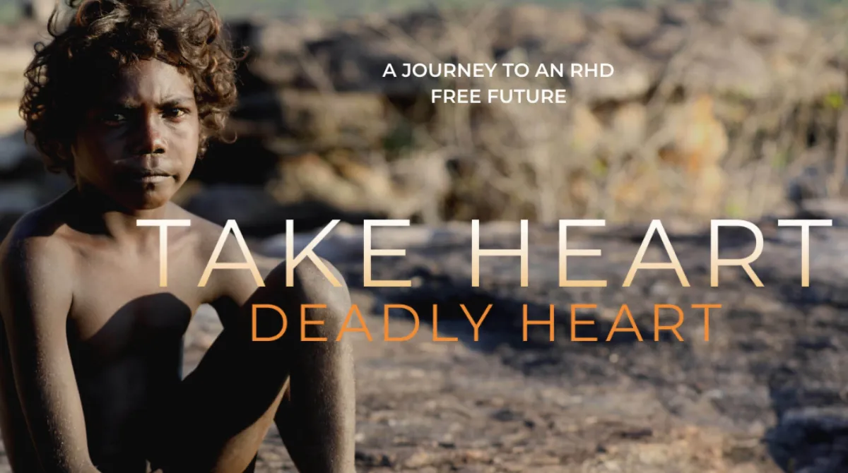 A young boy looks directly at the camera with a serious expression, standing outdoors with text overlay promoting a journey to a rheumatic heart disease-free future.