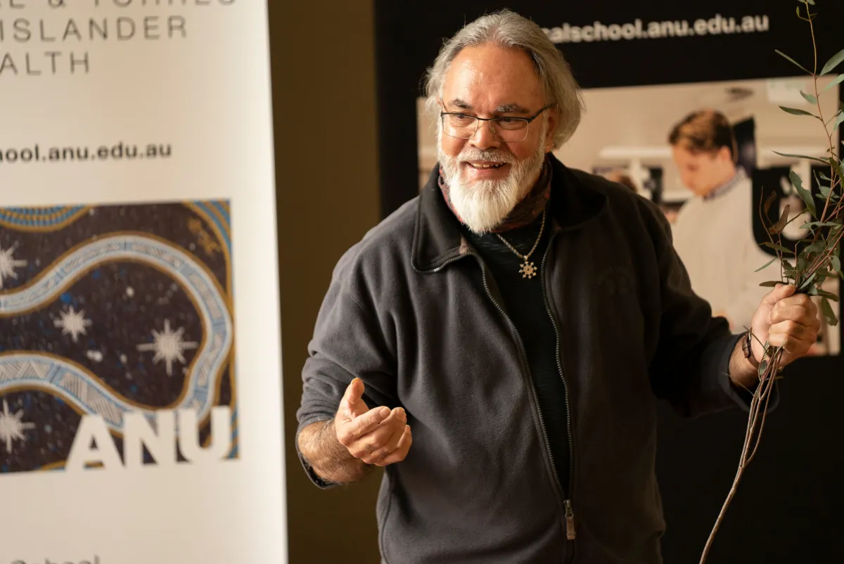 Wally Bell performs traditional cleansing ceremony