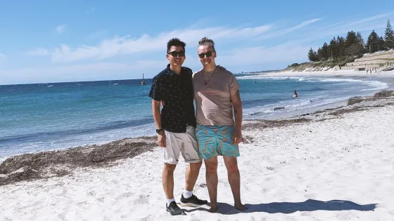Ben Harrap (right) and statistician Shih Ching Fu (Curtin University) on Perth's Cottesloe beach. Image: supplied