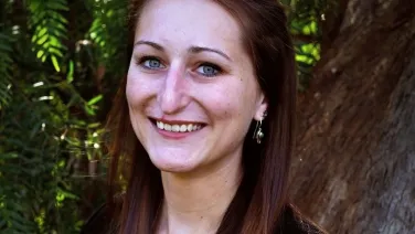 A woman looking at camera smiling
